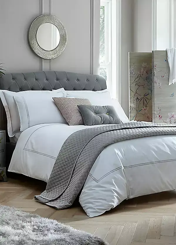 Hotel-style white and grey bedding